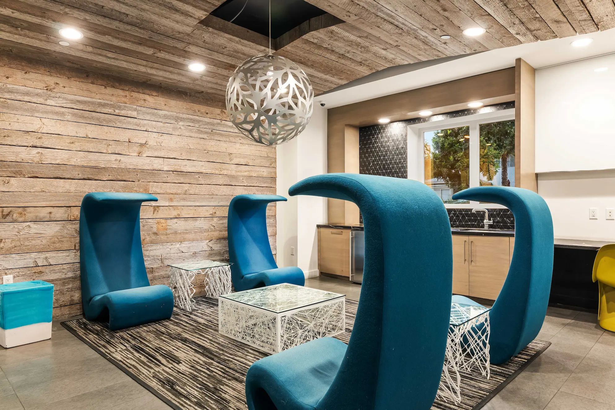 Modern resident lounge with designer seating at NoHo Lux
